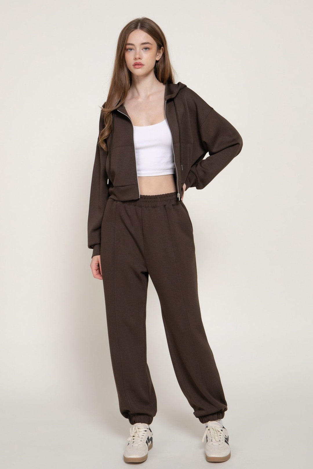 Dark brown joggers worn as a set with the dark brown hoodie jacket