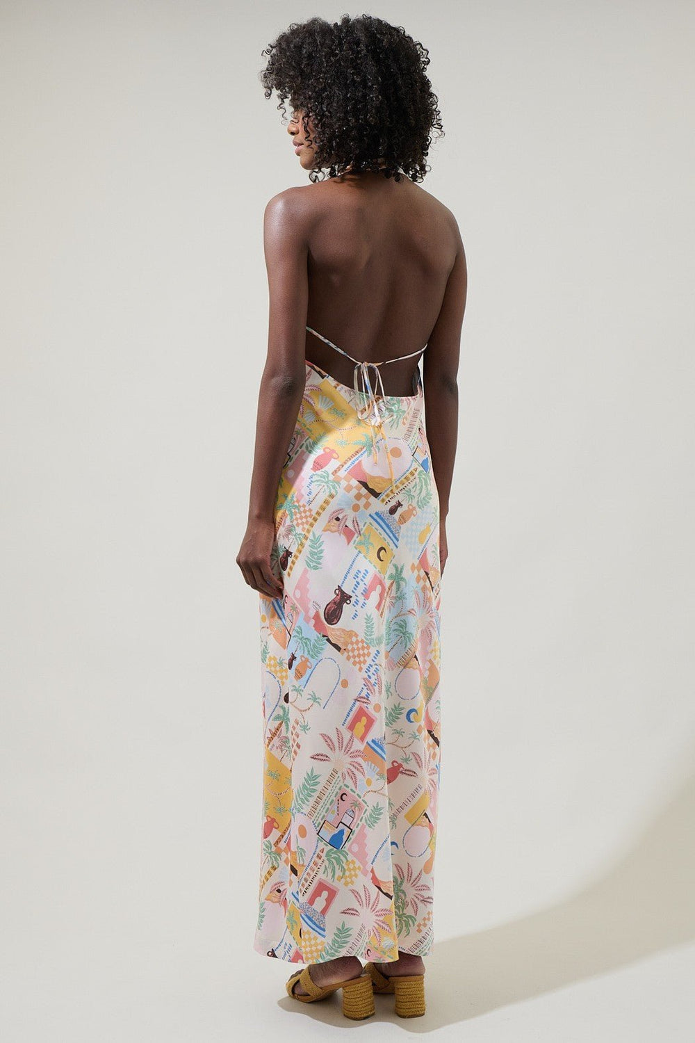 Charming multicolor print across a lined coral midi dress