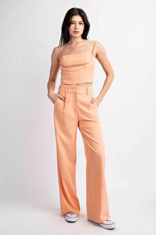 model is wearing Peach Sweetheart Woven Sleeveless Top with matching 