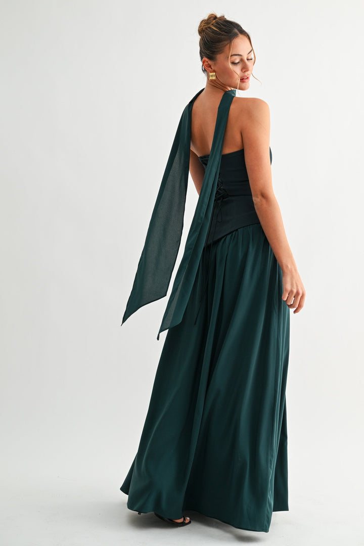 Emerald green lace-up maxi dress, back view with corset ties