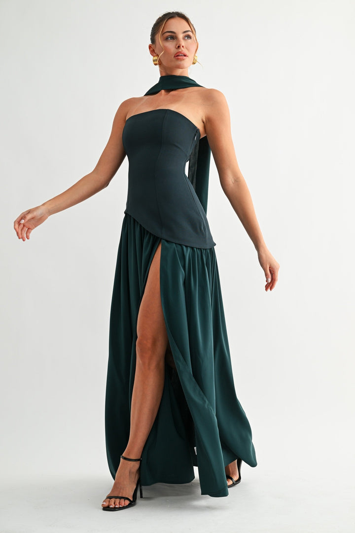 Emerald green maxi dress with dramatic high slit, walking