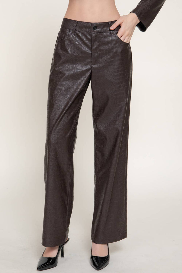 Front view of the dark brown crocodile pattern faux leather pants, a holiday party pant