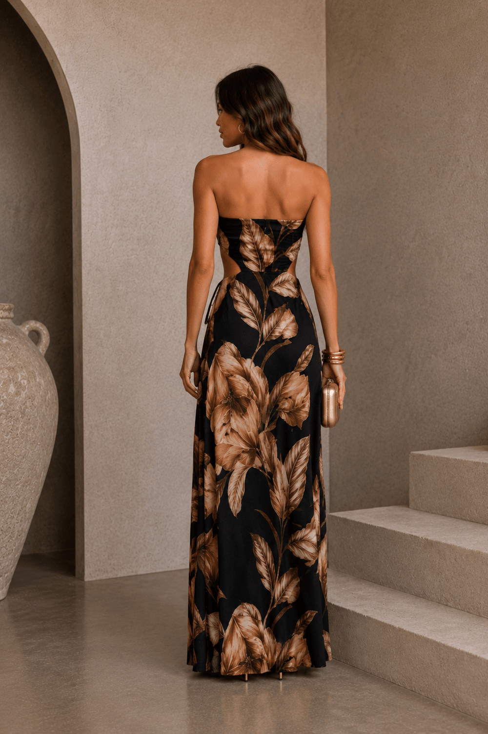 Side cutouts cinched by adjustable drawstrings on a floral maxi dress
