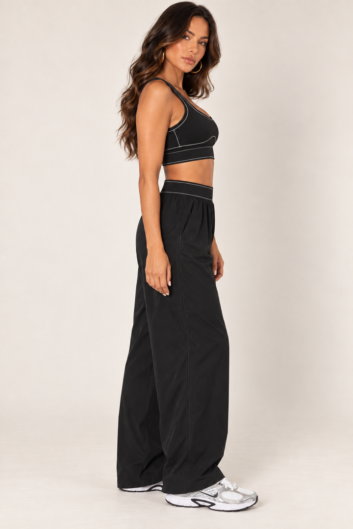 Black track pants — track side detail; coordinating pieces sold separately