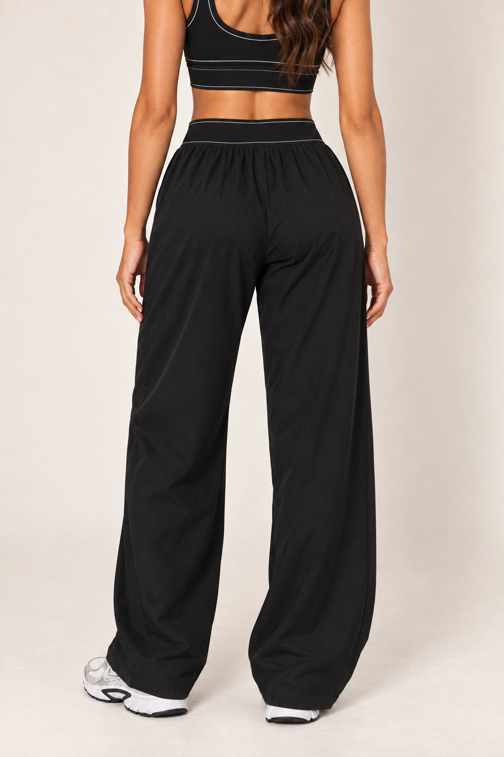 Black track pants — track back detail; coordinating pieces sold separately