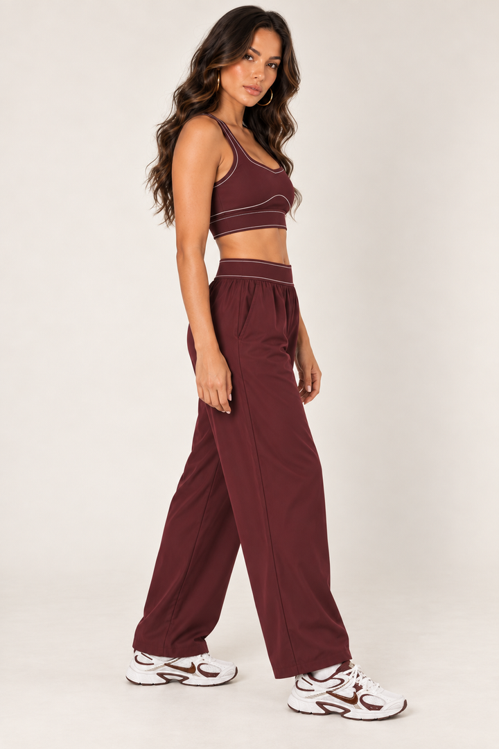 Glowy burgundy track pants — track full side