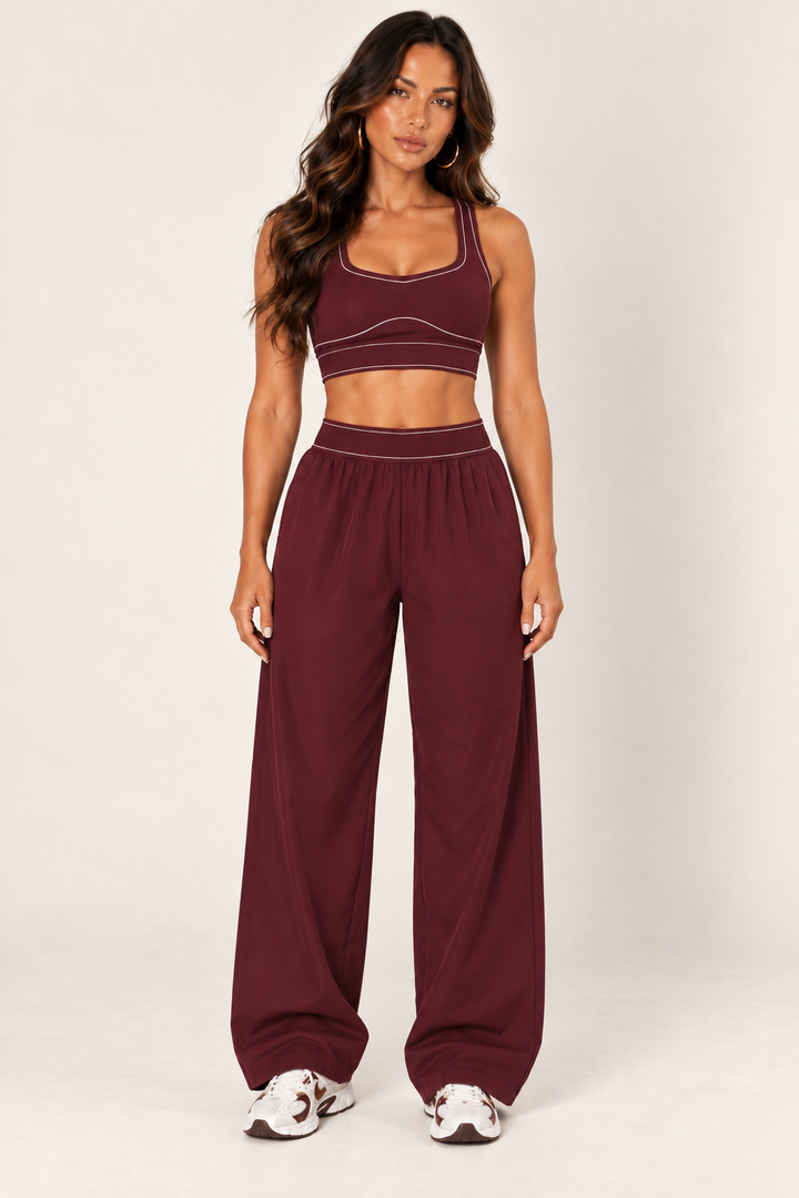 Glowy burgundy track pants — track front crop