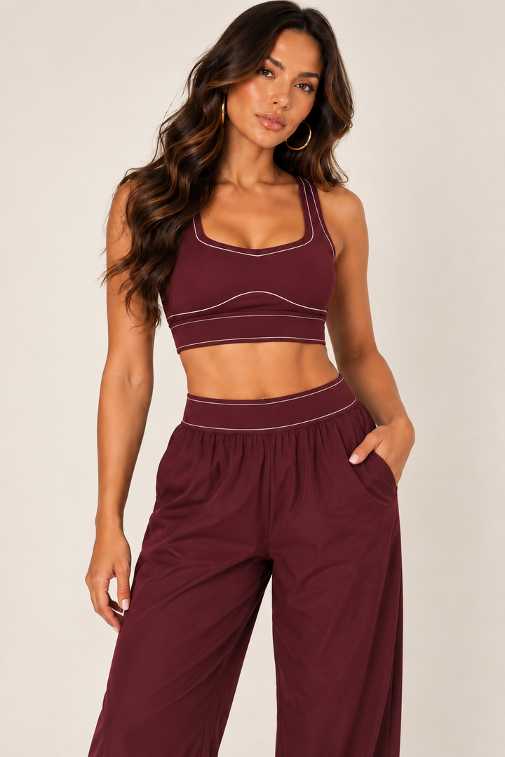 Glowy burgundy track pants — track waist detail