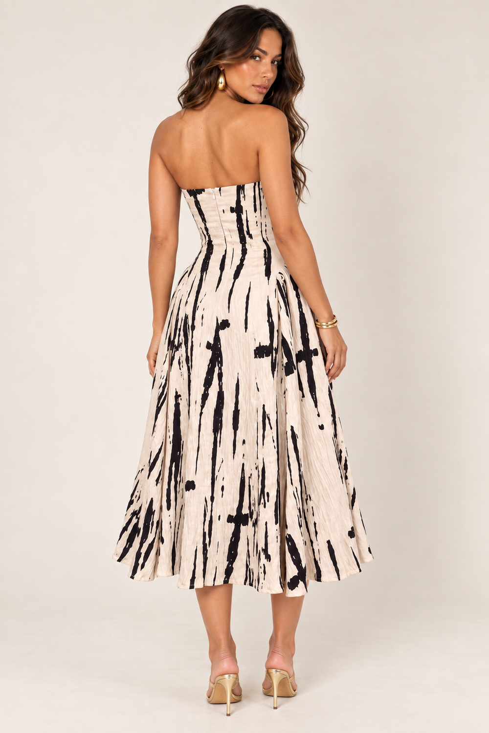 Back view of taupe black textured strapless midi dress on the ALX hair-down model