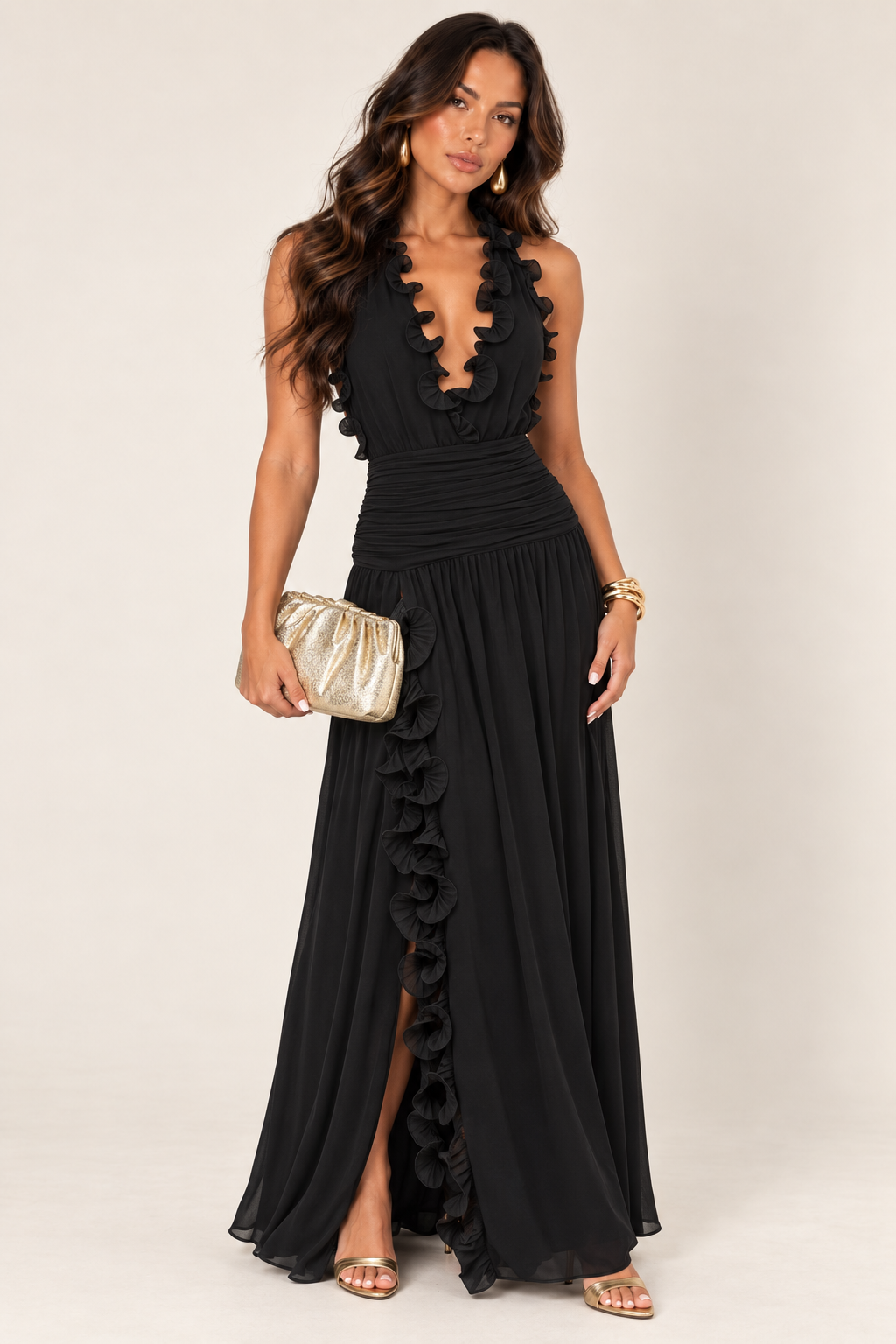 ALX hair-down model wearing black ruffle trim chiffon maxi dress styled with the gold ruched clutch
