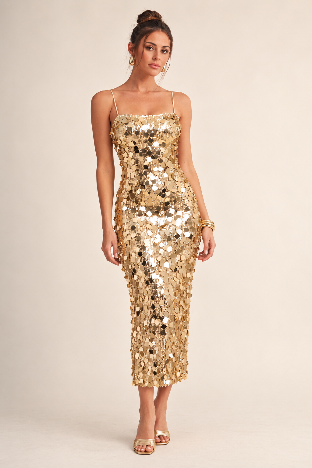 ALX model wearing Luxxel gold sequin mesh midi dress with gold accessories
