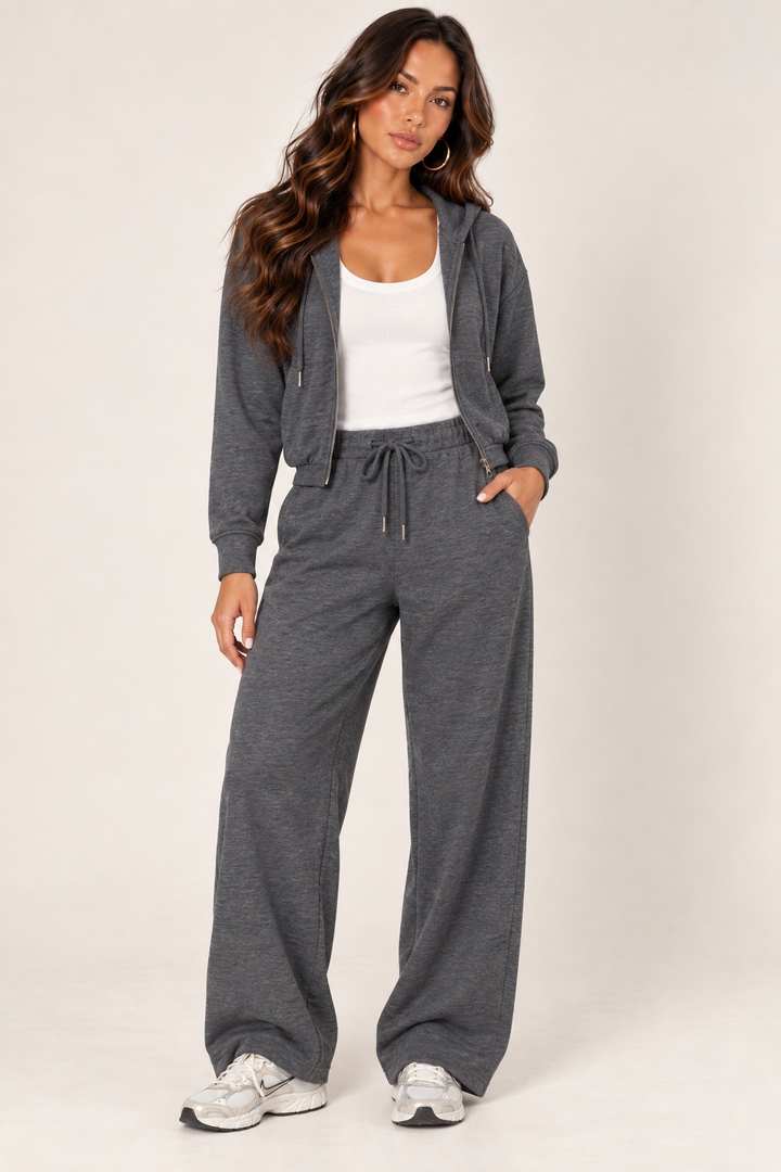 Dark Heather Grey cropped zip hoodie and wide-leg sweatpants styled with a white ribbed tank and Nike sneakers