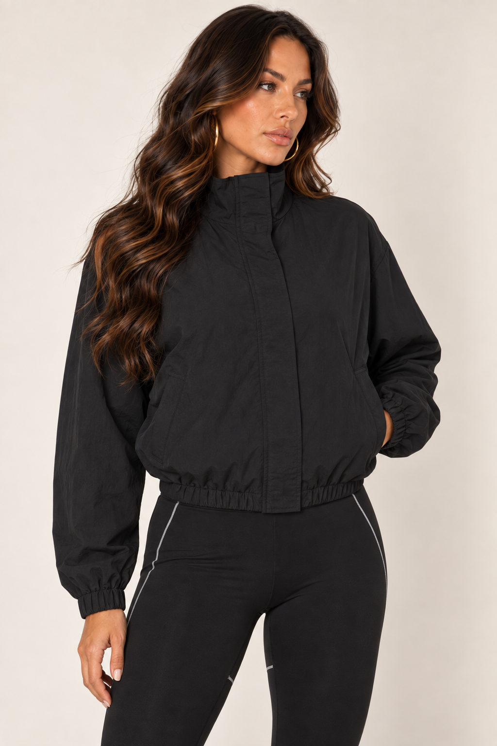 Black cropped windbreaker — thigh up right zipped