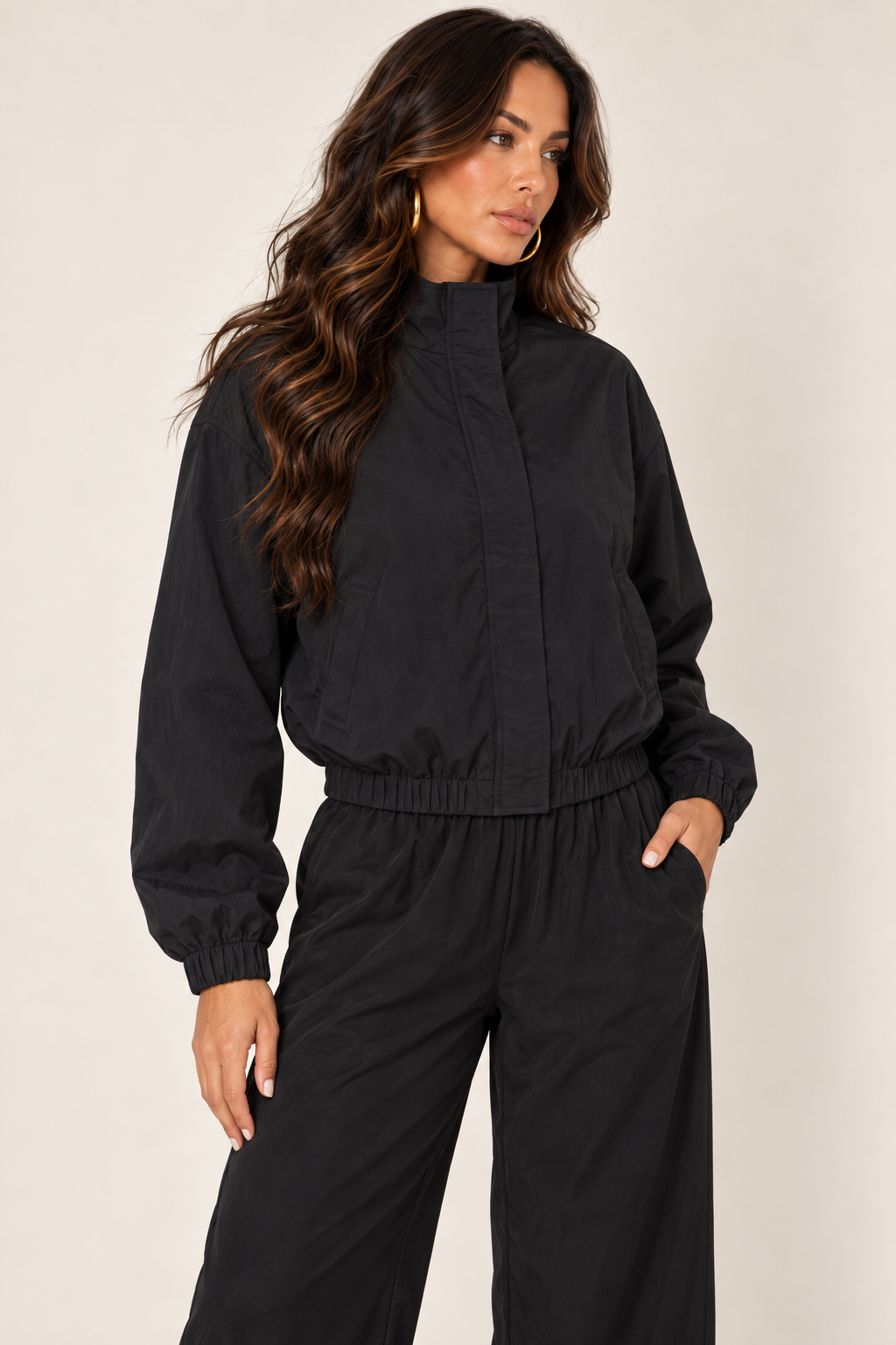 Black cropped windbreaker — thigh up right zipped