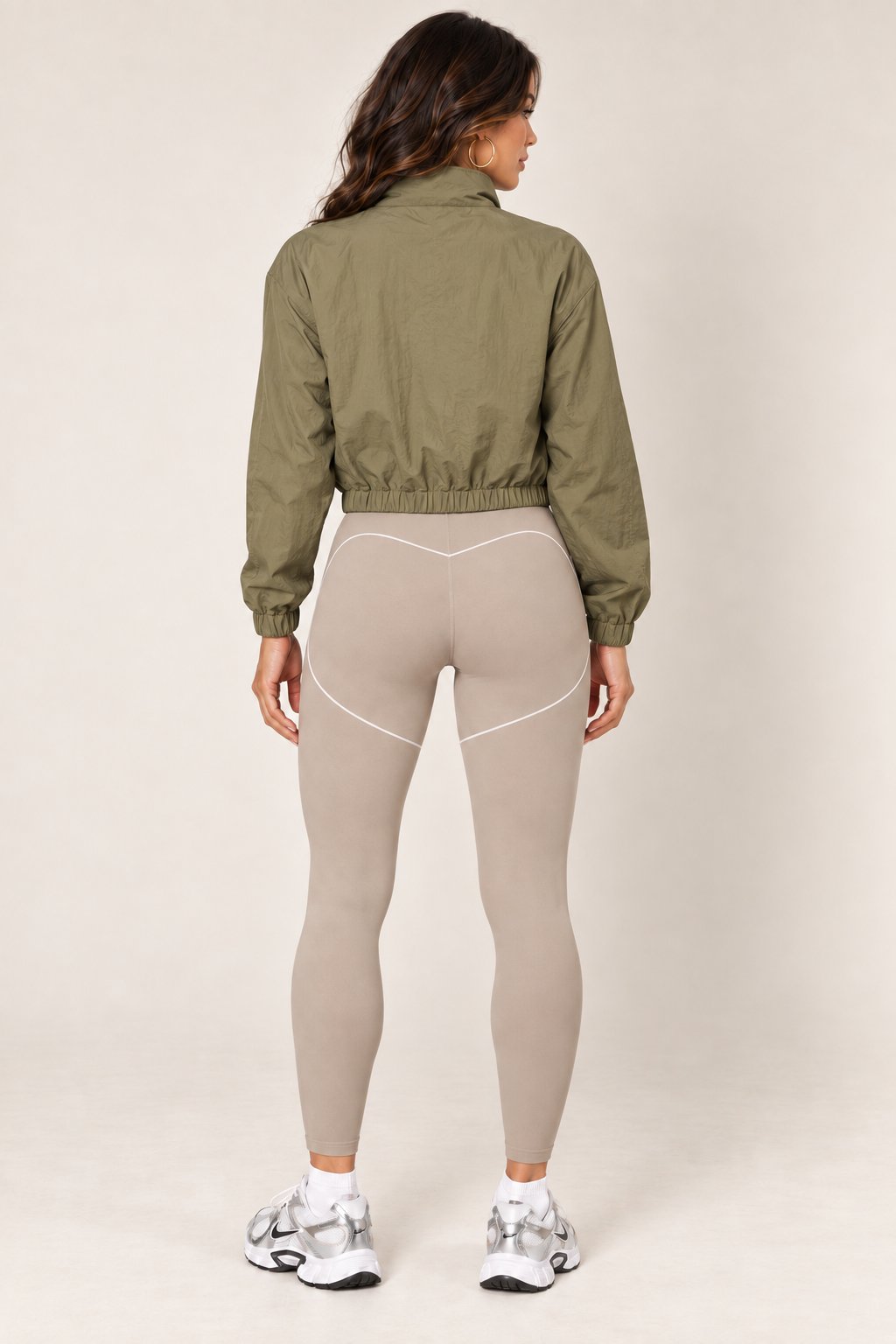 Olive cropped windbreaker with taupe leggings — full back