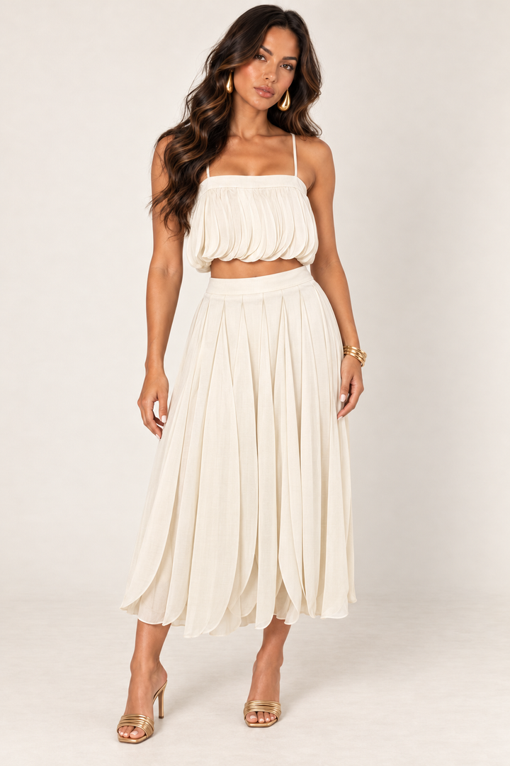 ALX model wearing Luxxel sand petal layer skirt set with gold accessories