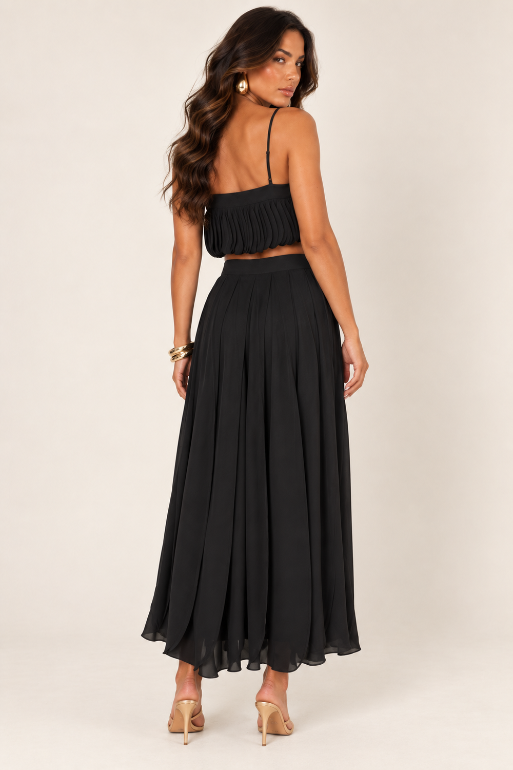 Back view of black petal layer skirt set on the ALX hair-down model