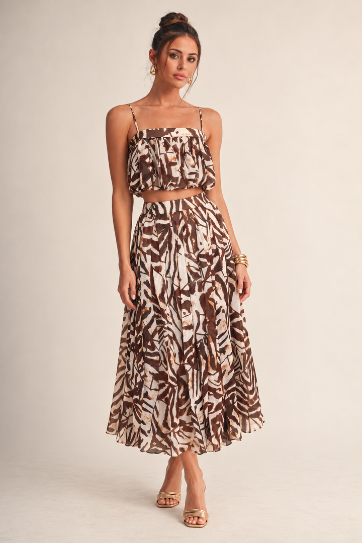 ALX model wearing Luxxel brown ivory mapelle petal layer skirt set with gold accessories