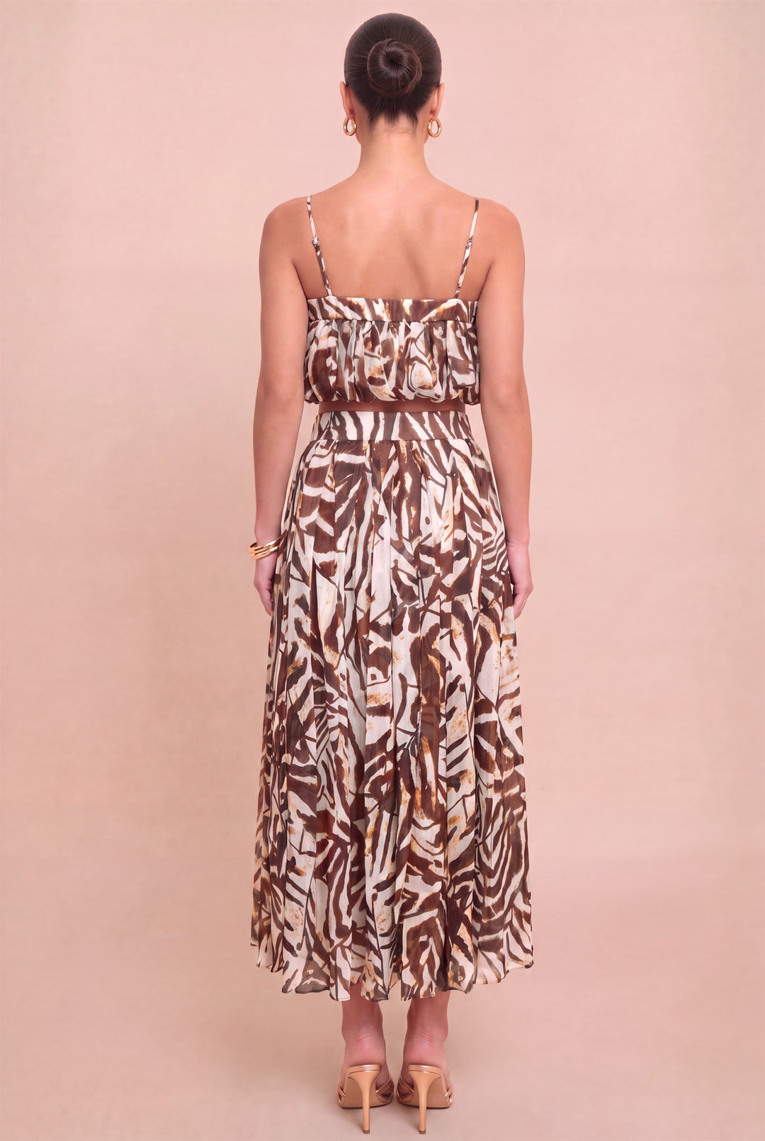 Back view of Luxxel printed crop top and flowing midi skirt