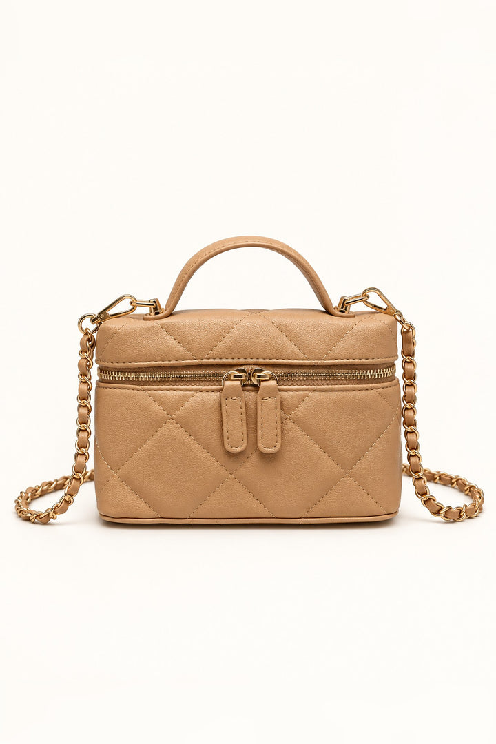 Front view of the Natural Snow Quilted Crossbody in tan vegan leather with gold chain strap and top handle