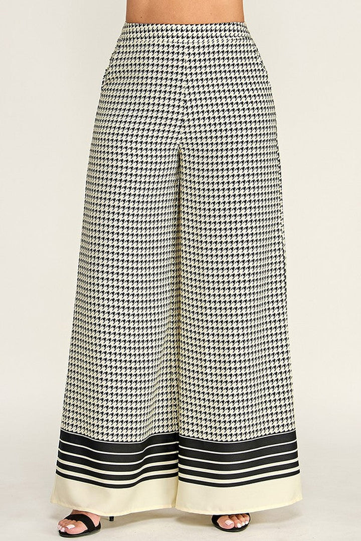 Black stripe border hem detail on the off white checkered palazzo pants