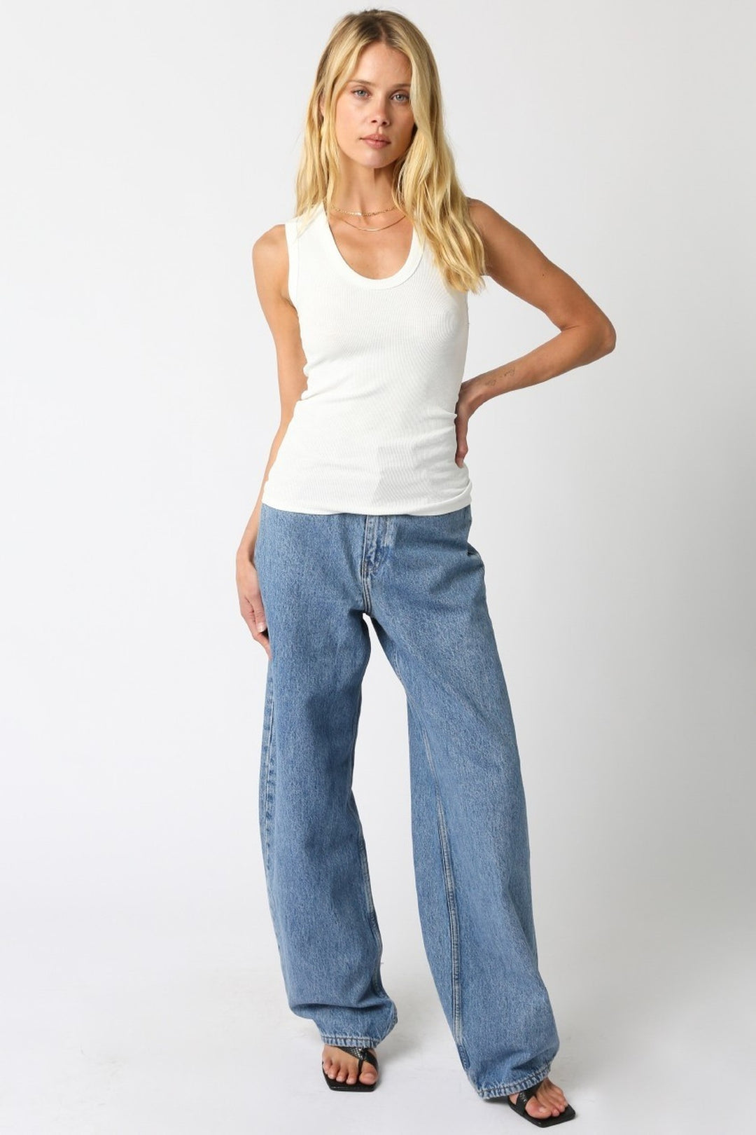 Off White Kelsey tank top worn with jeans, full length