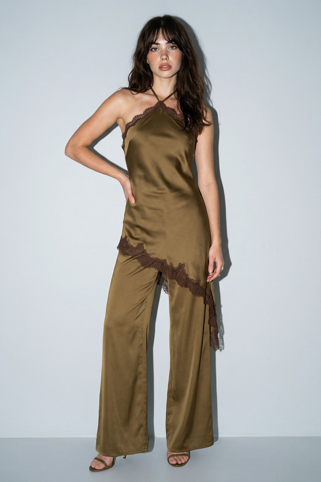 Olive satin halter jumpsuit with contrast lace trim and wide legs, front view
