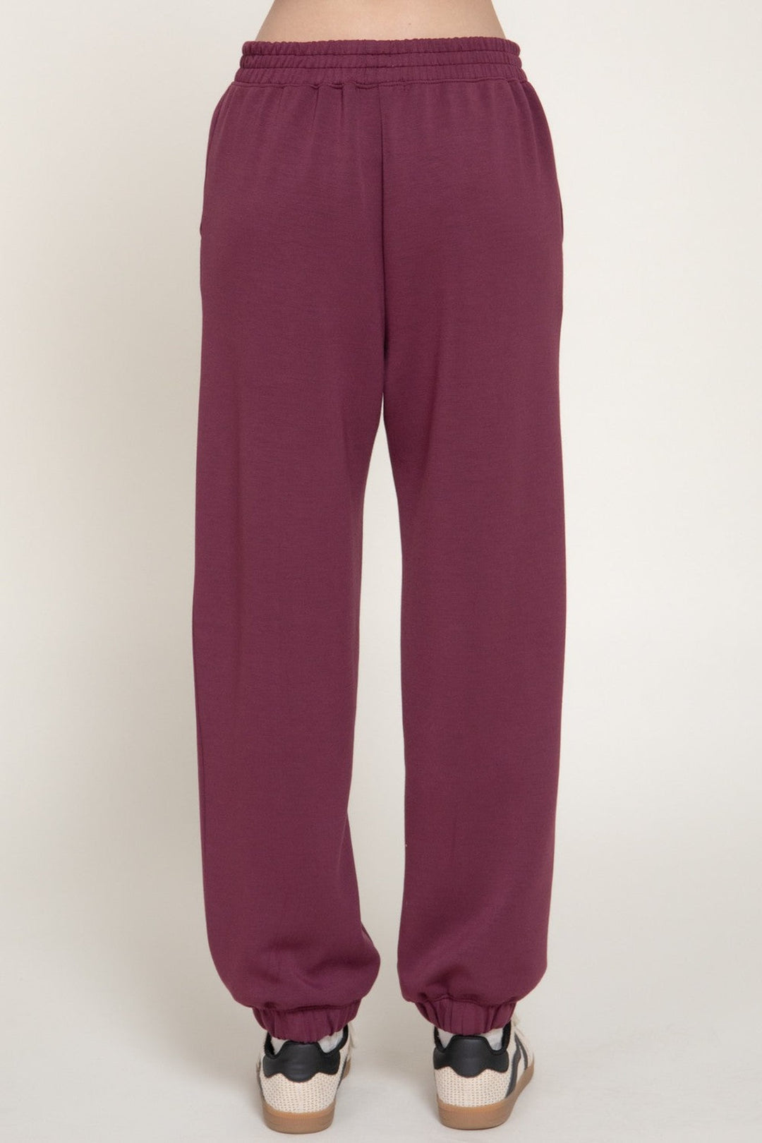 Plum pintuck soft scuba jogger pants, front view