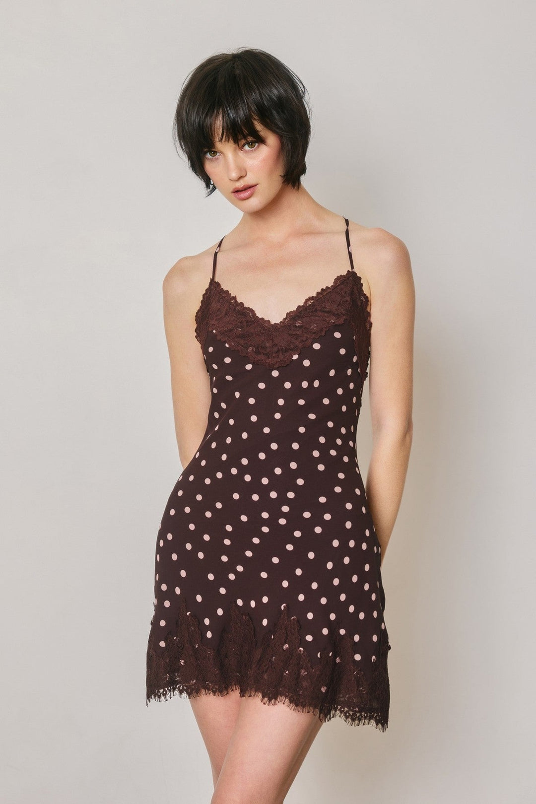 Plum polka dot lace trim slip mini dress with spaghetti straps and deep V-neckline