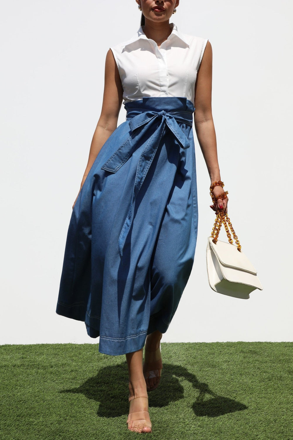Collared fitted bodice on a sleeveless white and denim midi dress