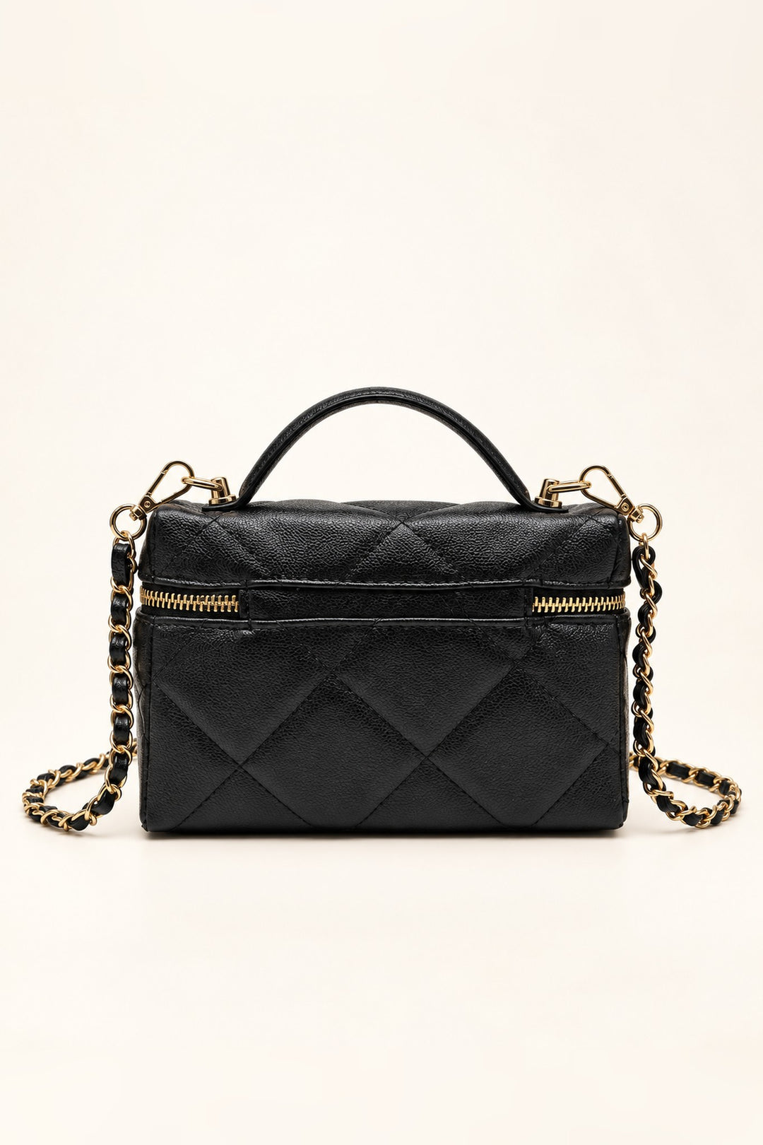 Back view of the black diamond-quilted vegan leather crossbody bag