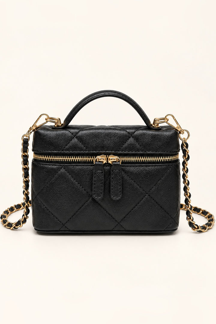 Front view of the Black Snow Quilted Crossbody in vegan leather with gold chain strap and top handle