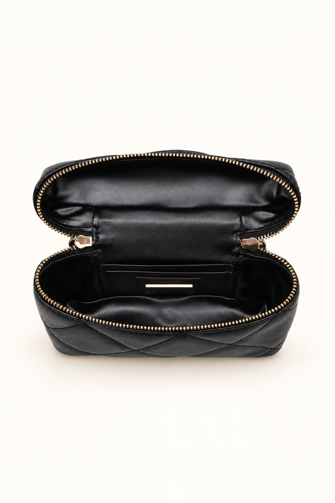 Open interior of the black quilted crossbody showing lined compartment with card and slip pockets