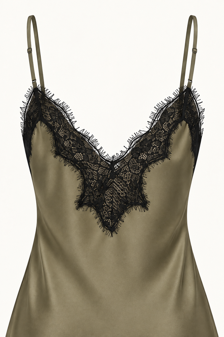 Product-only close-up of the Khaki Satin Lace Pants Set camisole back by Skylar Rose at Styled by ALX. Fine adjustable olive straps and black floral eyelash lace frame the low V-shaped rear neckline, with the smooth olive-khaki satin below shown against an ivory background.