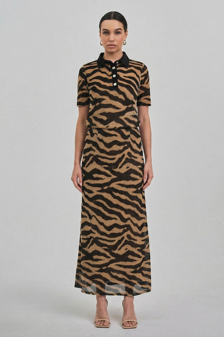 Zebra print maxi skirt worn with the matching zebra polo top