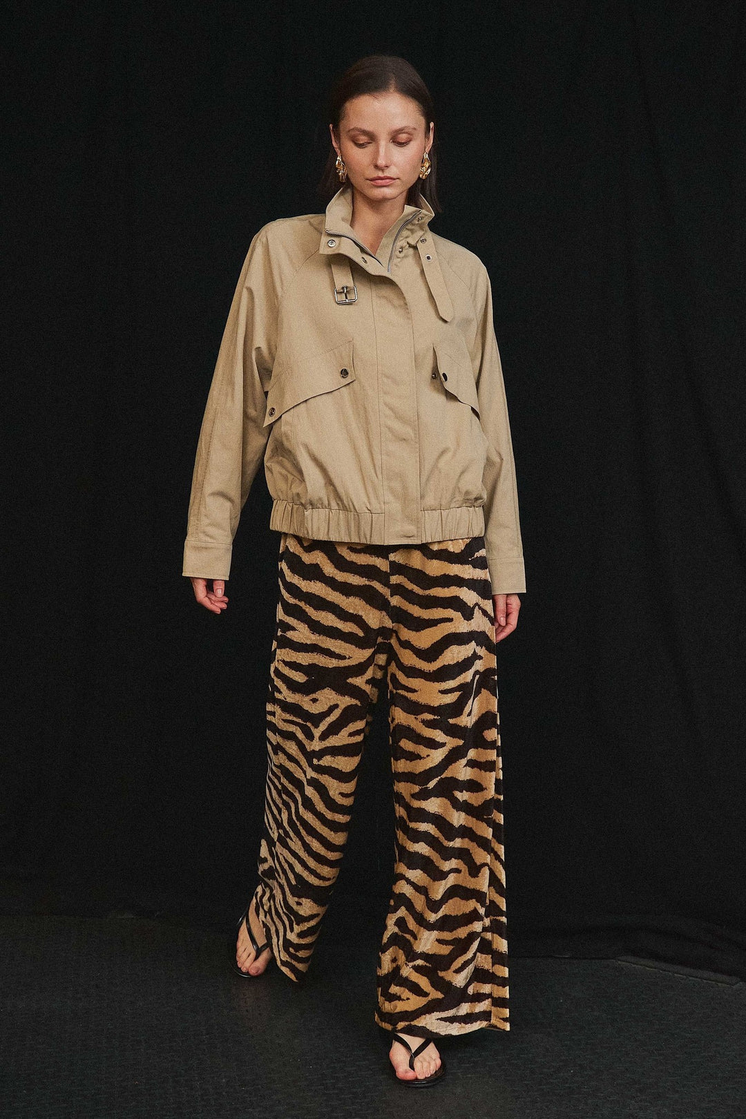 Zebra print wide leg pants styled with a khaki jacket
