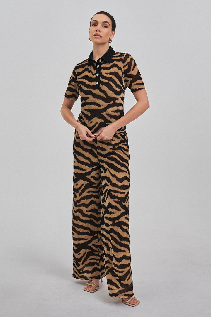 Zebra print polo top styled as a full set with the zebra pants