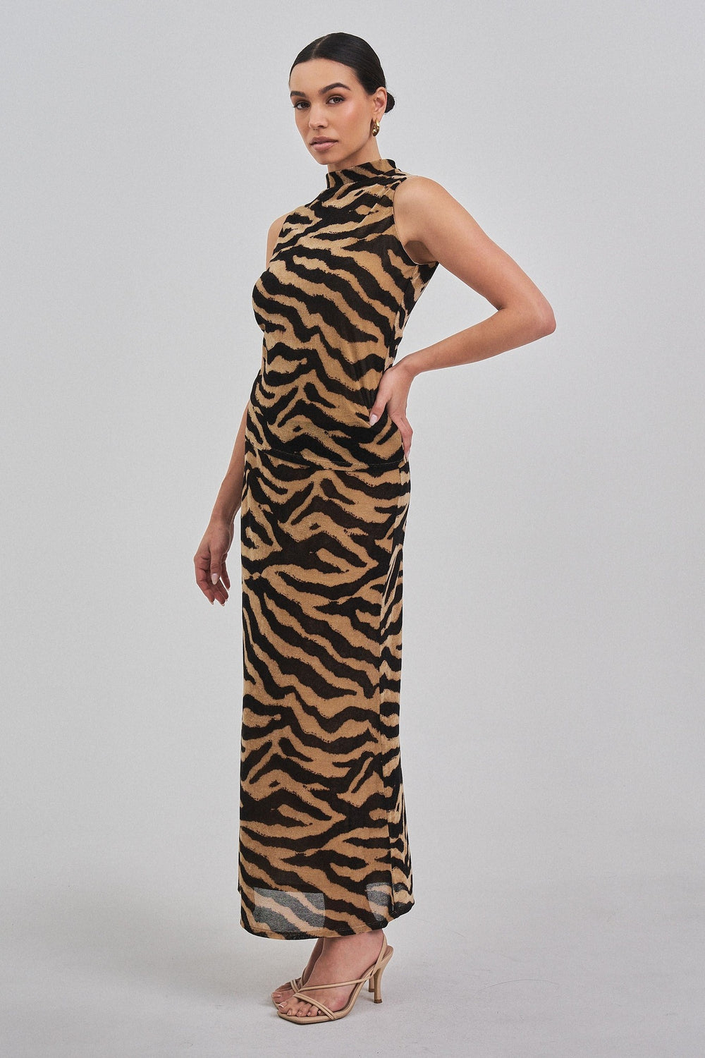 Zebra print sleeveless mock neck top, side view