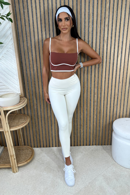 STYLED BY ALX COUTURE MIAMI BOUTIQUE Cinnamon Sculpting Bra Tank Paired With Cream Aligned Performance High-Rise Leggings For An Active Look