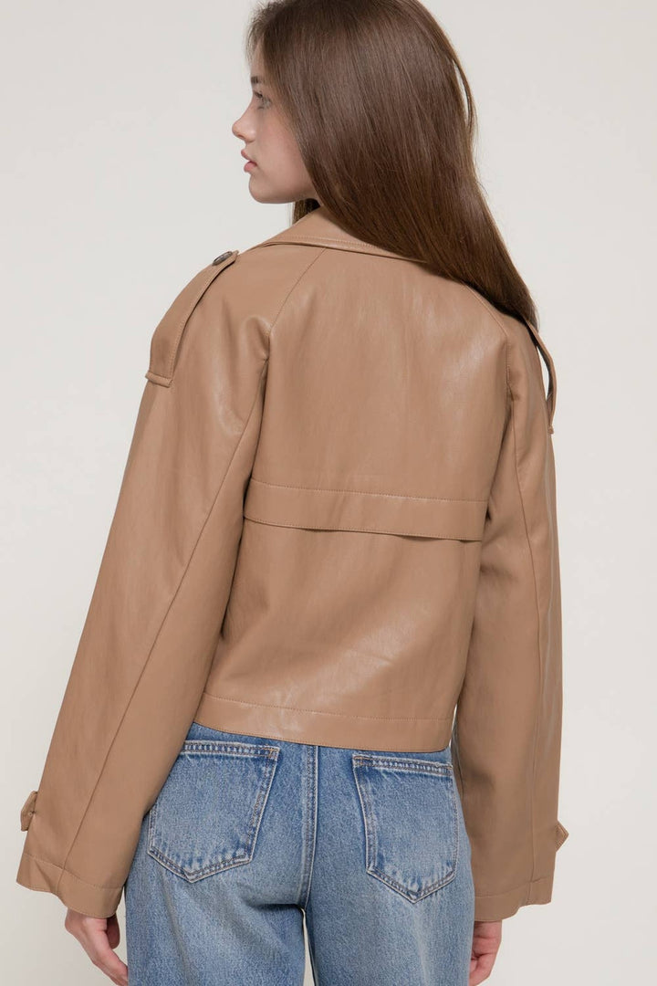 Back view of the toffee faux leather short trench coat showing the storm flap and boxy cropped fit