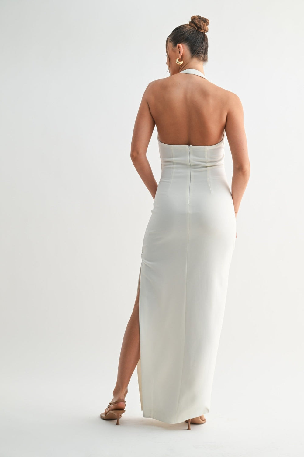 Smooth stretch white fabric skimming a full length silhouette