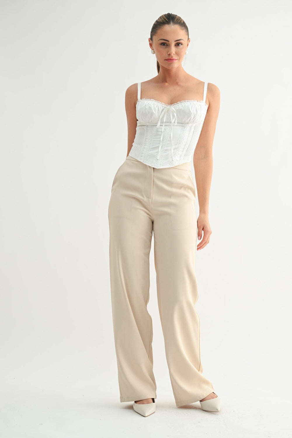 Structured boned corset top in white satin with delicate lace trim
