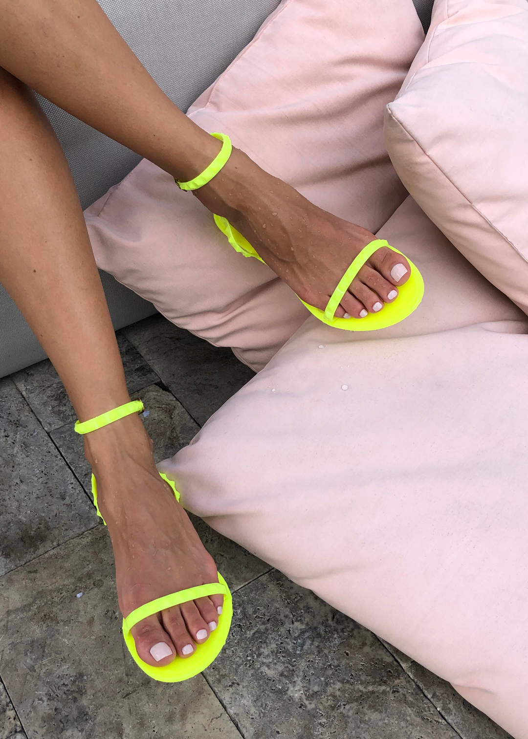 Women's Aria Neon Pink jelly sandals with studded strap across the toes and ankle strap by Alexandria Brandao Shoes.