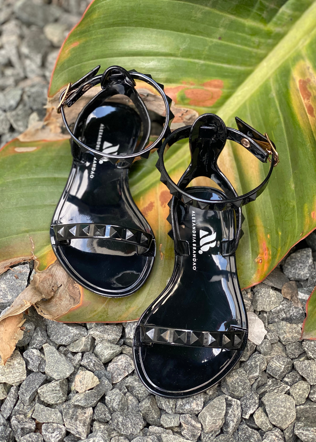Kid's Aria Black Sandals with thin strap around the ankle this sandal is perfect for beach and pool days, you can wear them with a casual chic look