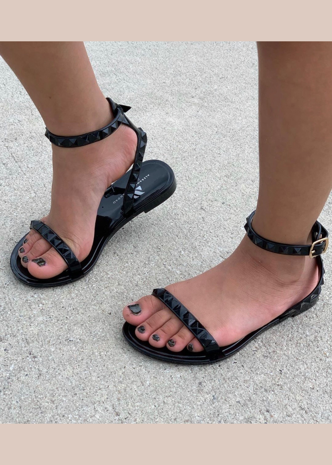 Kid's Aria Black Sandals with thin strap around the ankle this sandal is perfect for beach and pool days, you can wear them with a casual chic look
