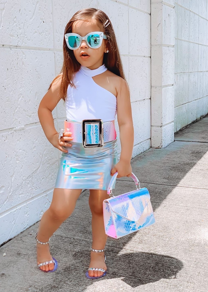 Aria Kids silver jelly sandals with thin strap across the toes and thin ankle strap, these sandals are perfect for beach or pool days, you can wear them with a casual chic look