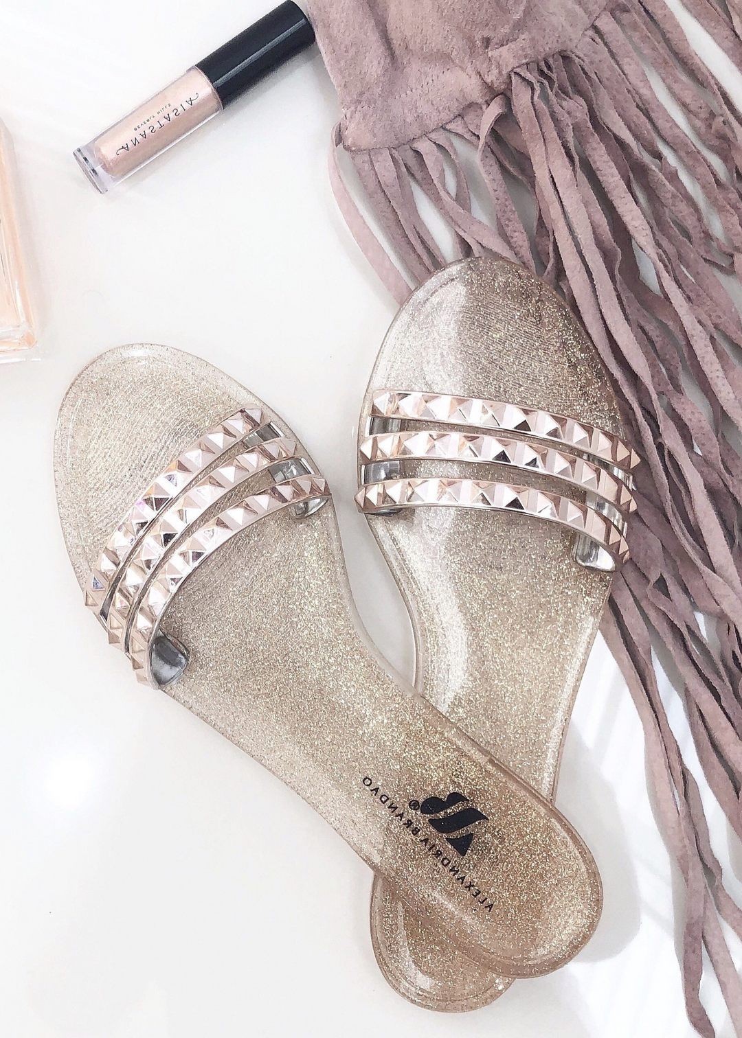 Aria B rose gold jelly sandals.