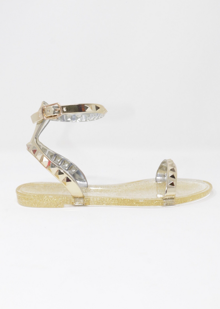 Aria kids jelly sandals in Gold. Side view